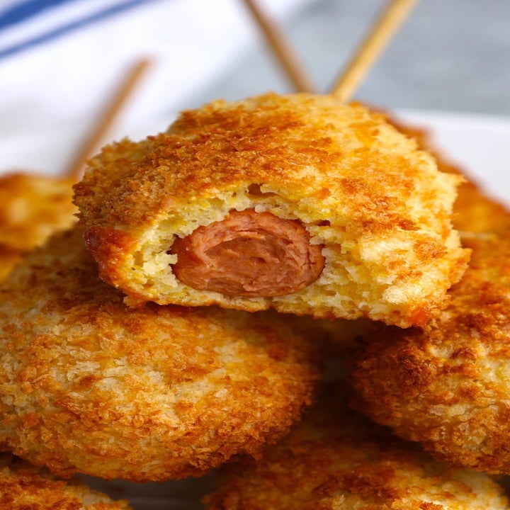 Corn dogs on sticks.